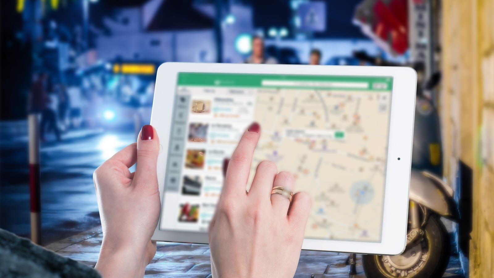 Two hands hold a tablet on a city street at night, scrolling a list of nearby restaurants beside a map dotted with pins, the way a diner picks where to eat.