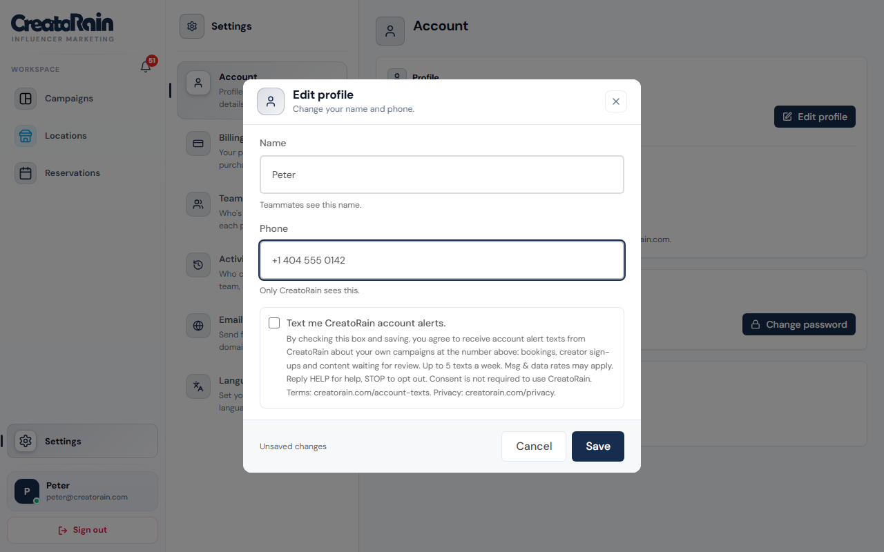 The Edit profile dialog in CreatoRain Settings. Under the phone field is an unchecked box labelled: Text me CreatoRain account alerts. Below it is the consent sentence.